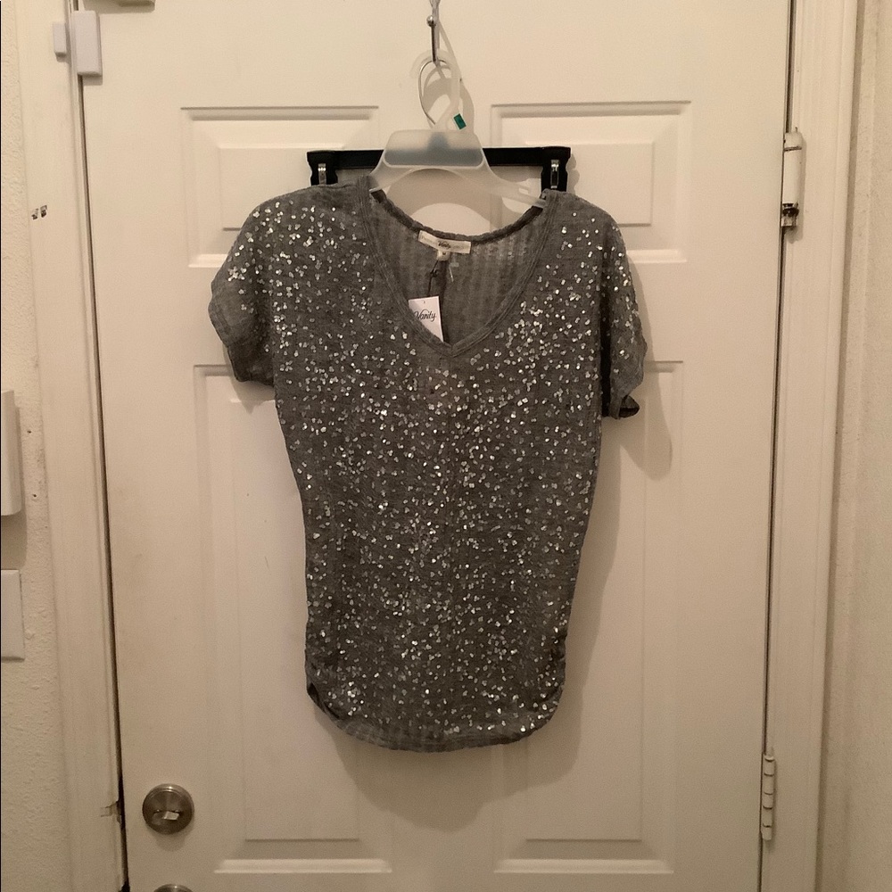 Lady’s gray blouse by Vanity medium